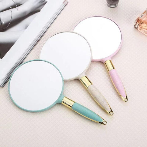 Espejo de maquillaje de mano